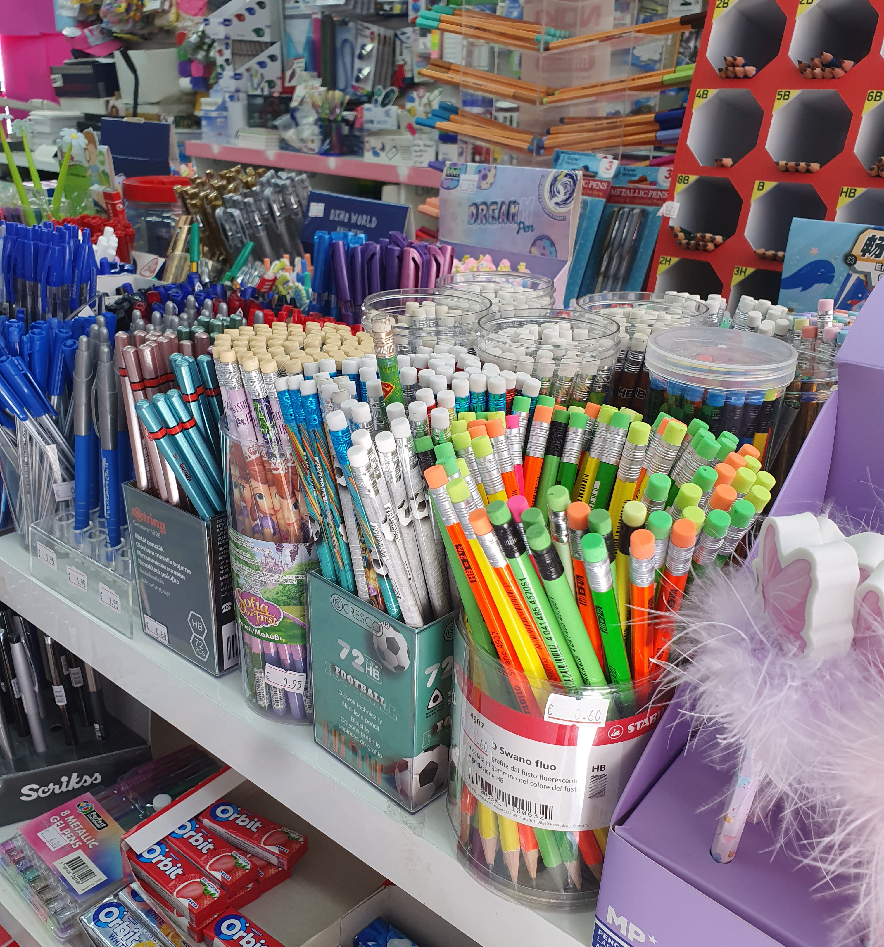 Stationery display with pens, pencils, and colourful writing supplies